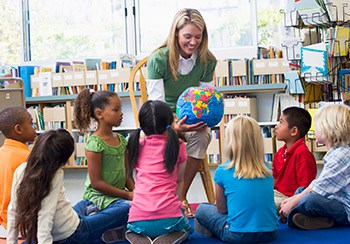 Female Teacher and group of children