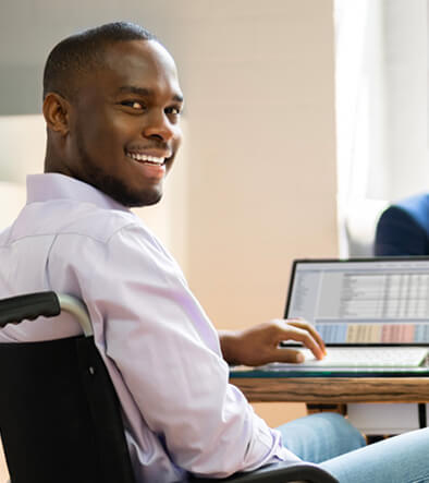 smiling young accountant working on a computer