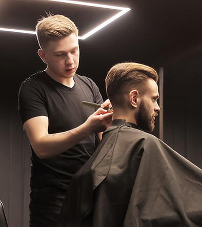 barber cutting a man's hair