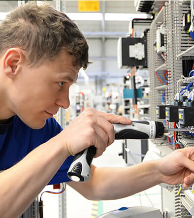 Electricity Student workin on a panel